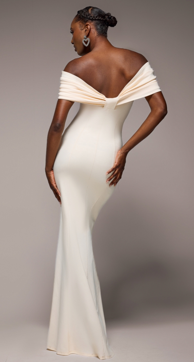 A cream full length dress from the new Midnight Muse collection by Goddiva