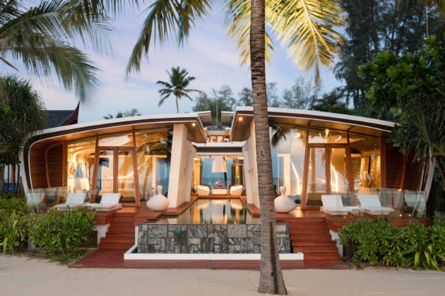 outside view of glass suite on beach