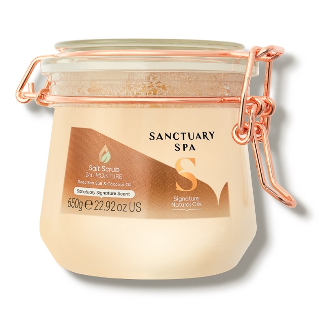 glass jar of peach body scrub