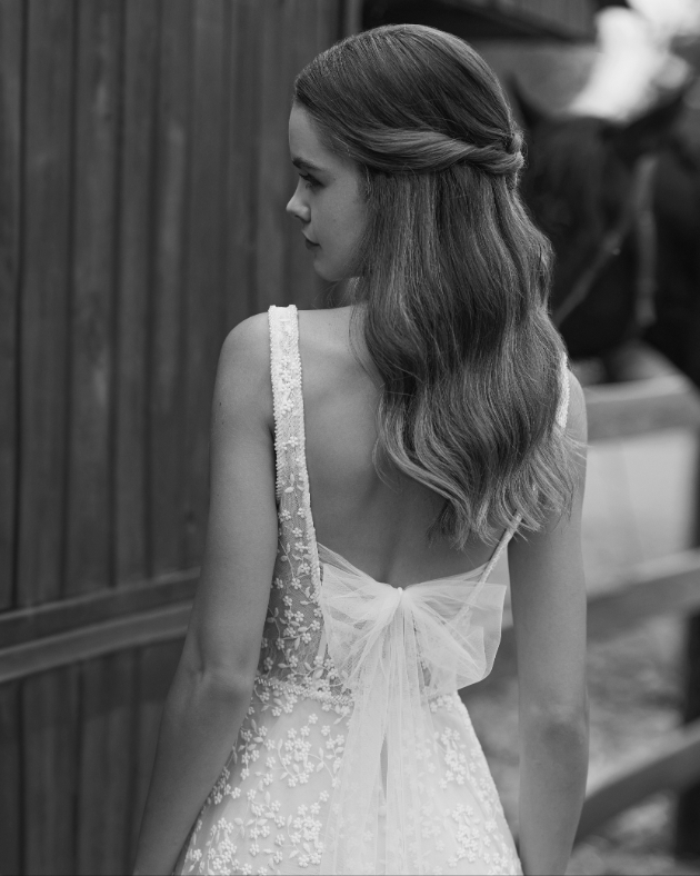 model in dress with back view of bow