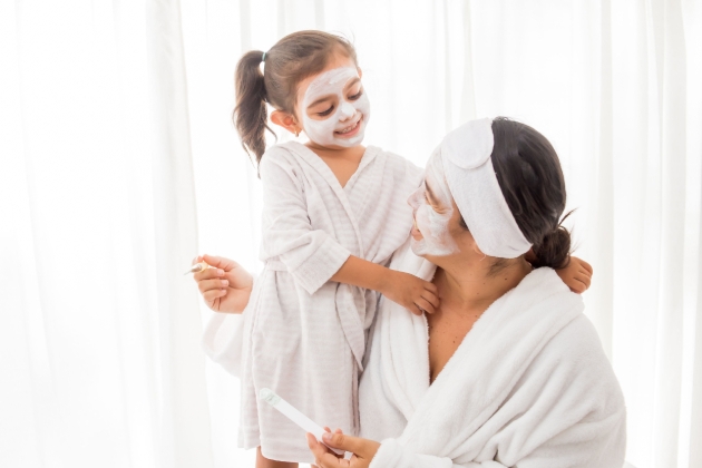 mum and daughter doing face mask