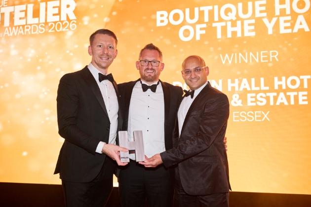Three men holding award at Boutique Hotel of the Year awards
